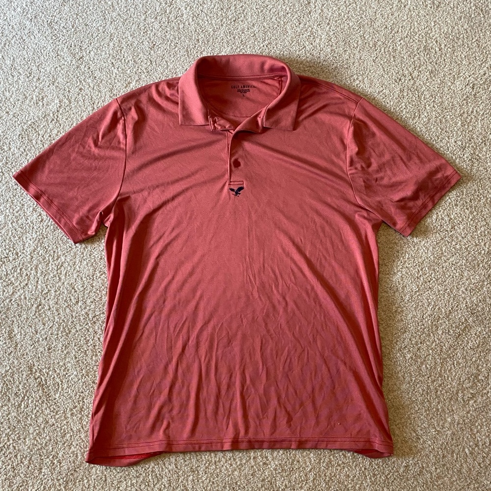 Pink/Orange Golf America polo shirt. Size Large. Fits loose, breathable fabric.